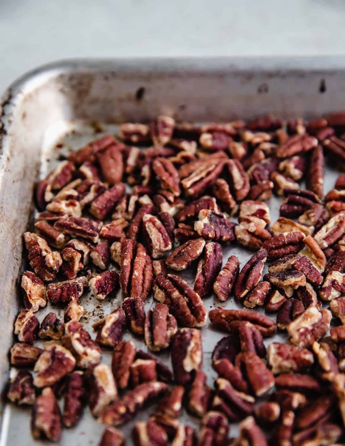 Toasted pecans on a pan.