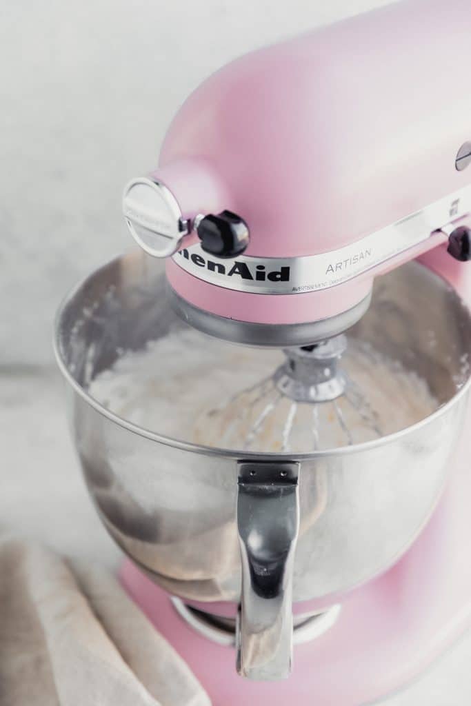 almond frosting inside a pink kitchen aid mixer