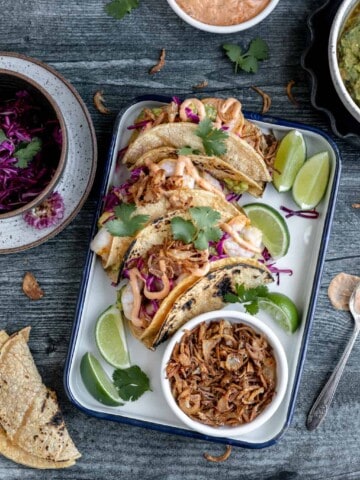 shrimp tacos with limes and crispy fried shallots