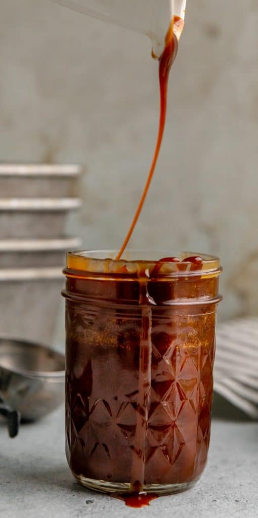 caramel sauce in a jar being drizzled in from above