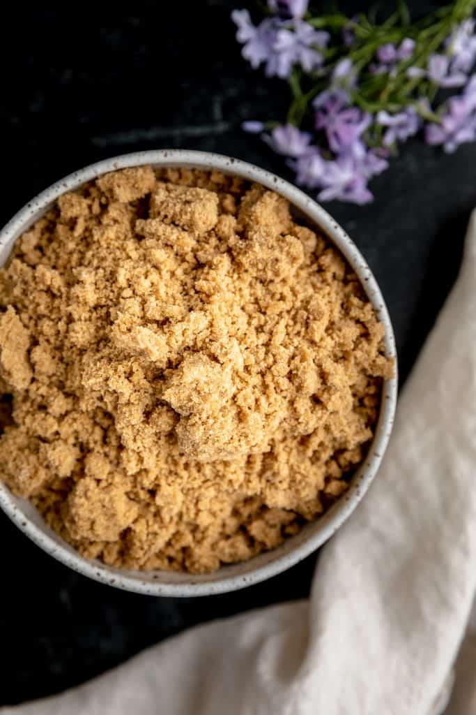 a bowl of streusel with purple flox