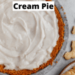 the coconut cream filling layered into the butter cookie pie crust before the topping goes on with a plate of butter cookies next to it