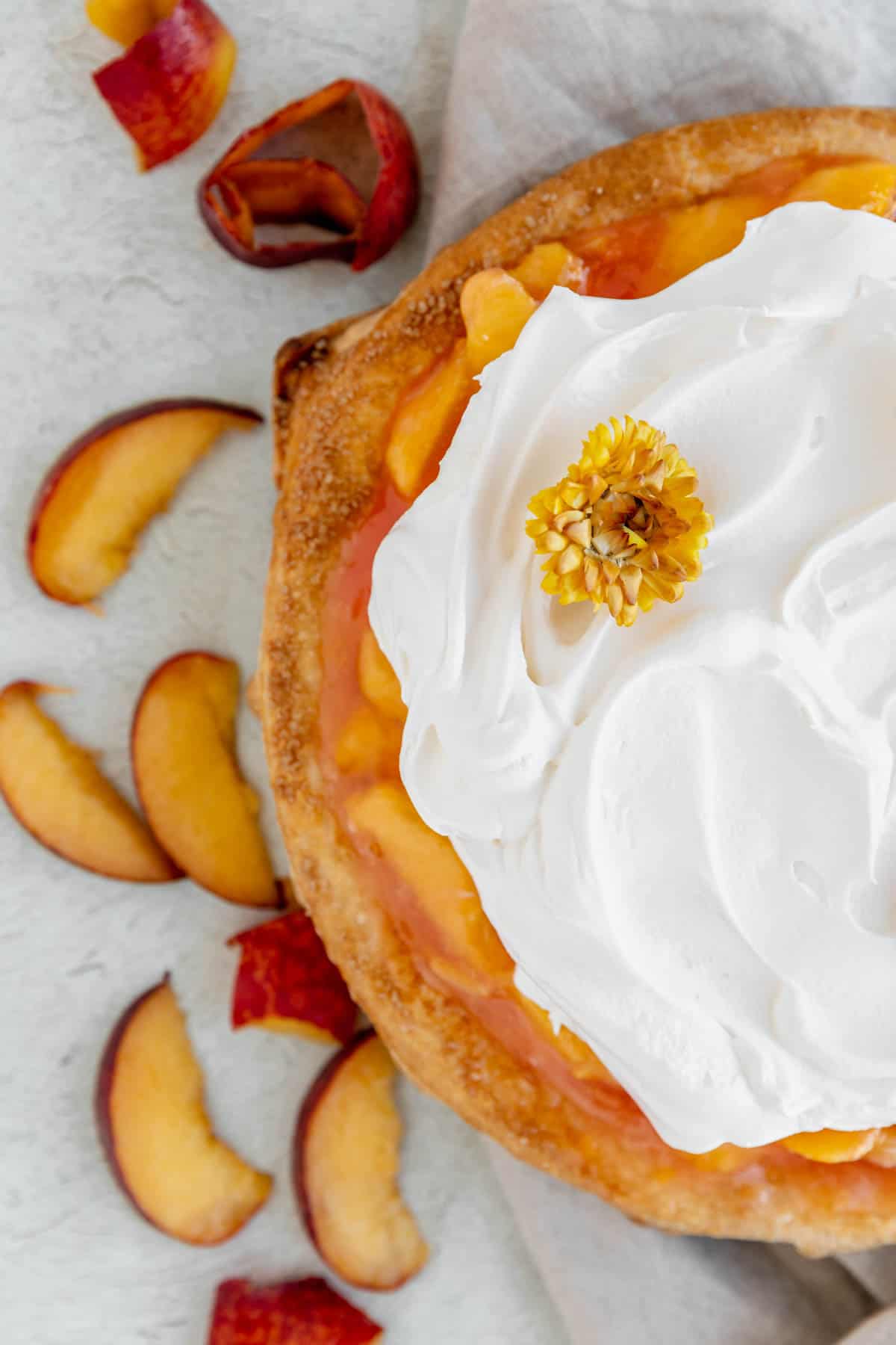 Peaches and Cream Pie with whipped cream on top. 