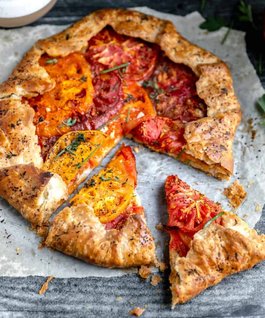 heirloom tomato galette with 2 slices cut out of it