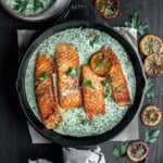 Cast Iron Salmon topped with creamy schug sauce and cilantro.