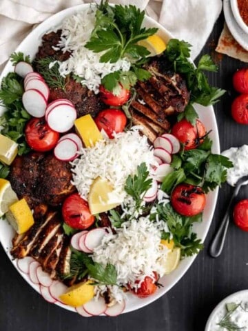 Chicken shawarma platter with rice, herb salad and tzatziki sauce