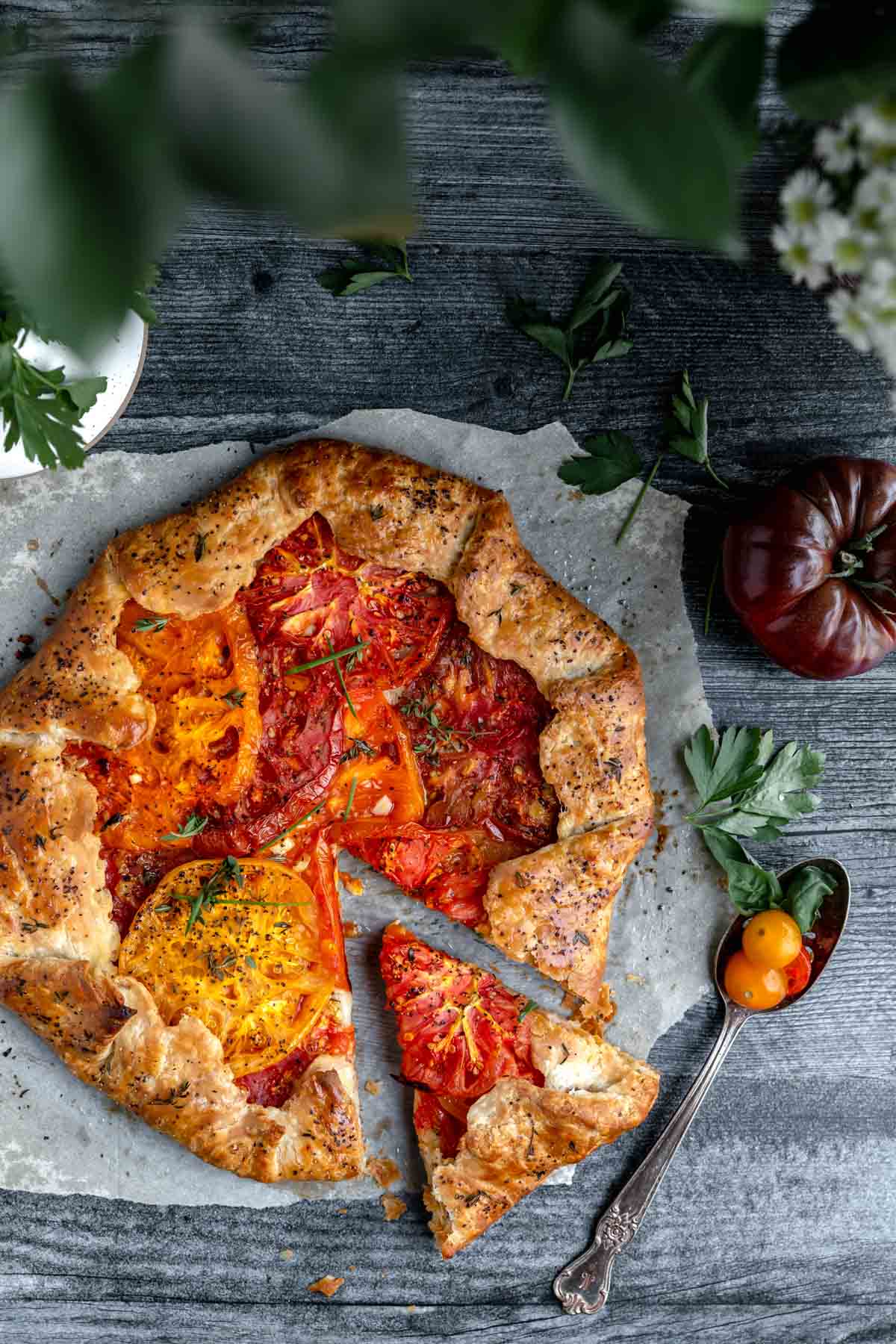 Heirloom Tomato Galette with a slice taken out of it. 