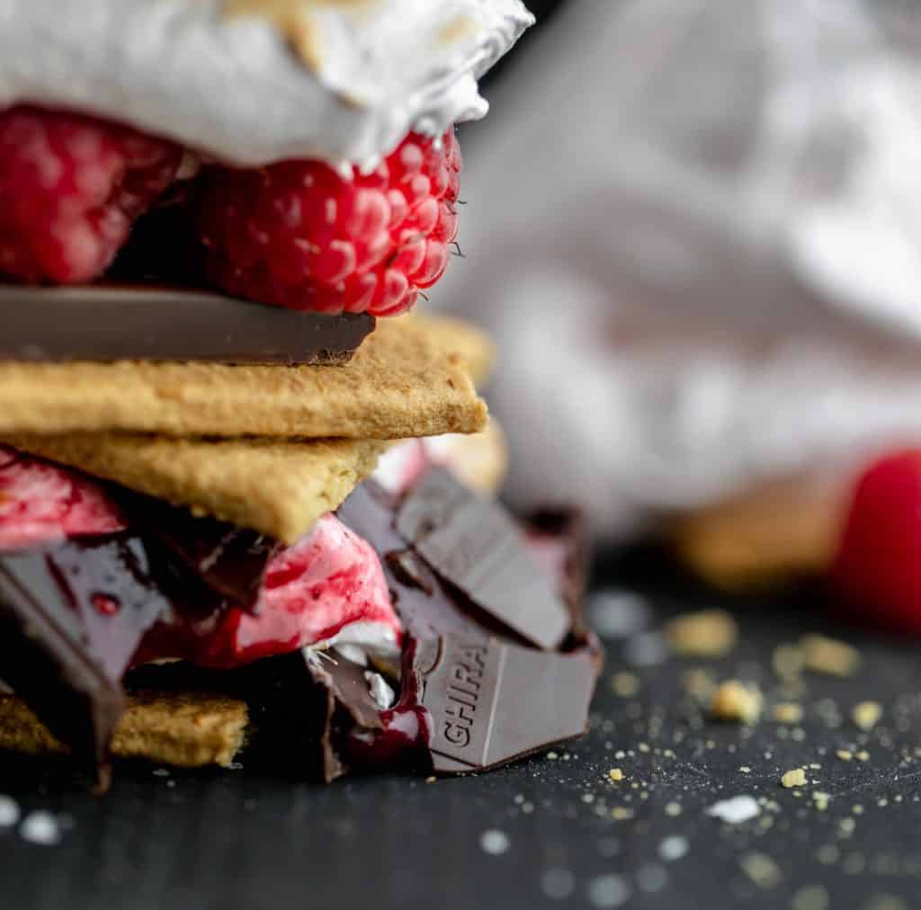 close up on a smashed raspberry ghirardelli chocolate square