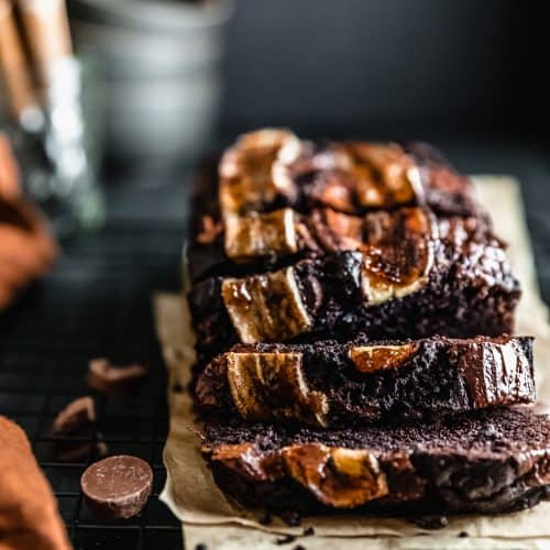 chocolate espresso banana bread sliced on a cooling rack