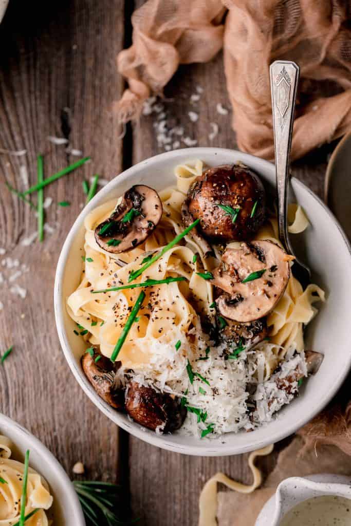 a bowl of mushroom and truffle pasta