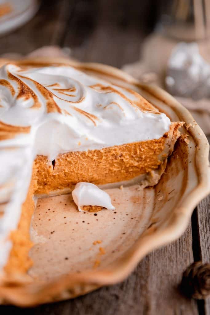 a shot of the inside of the sweet potato pie with toasted meringue on top