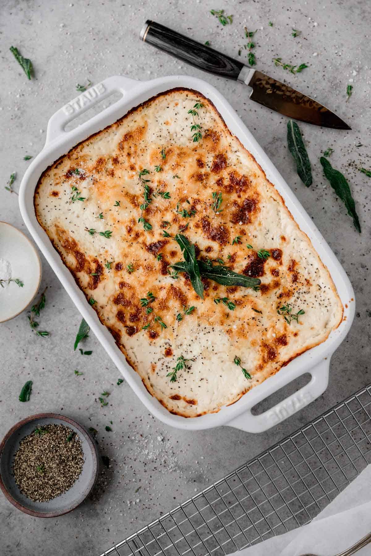 Au Gratin Potatoes baked and browned on top in a baking dish. 