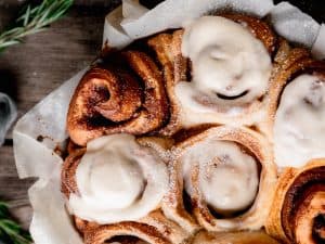 baked gingerbread cinnamon rolls with eggnog frosting