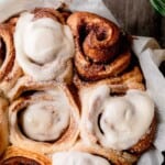 Gingerbread Cinnamon Rolls topped with cream cheese icing.