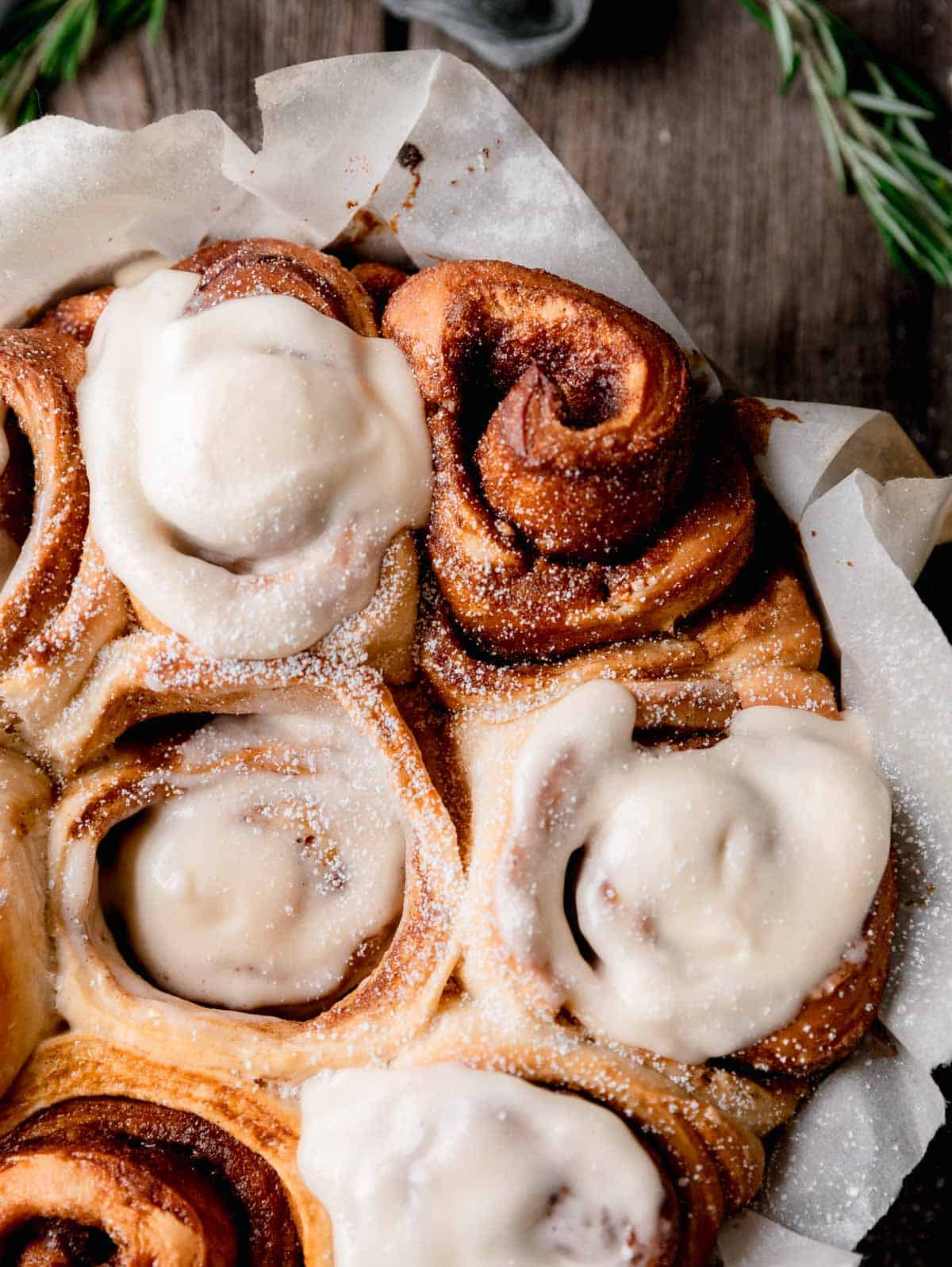 Gingerbread Cinnamon Rolls topped with cream cheese icing. 