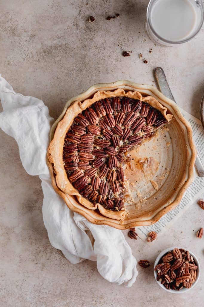 pecan pie with a couple slices cut out 