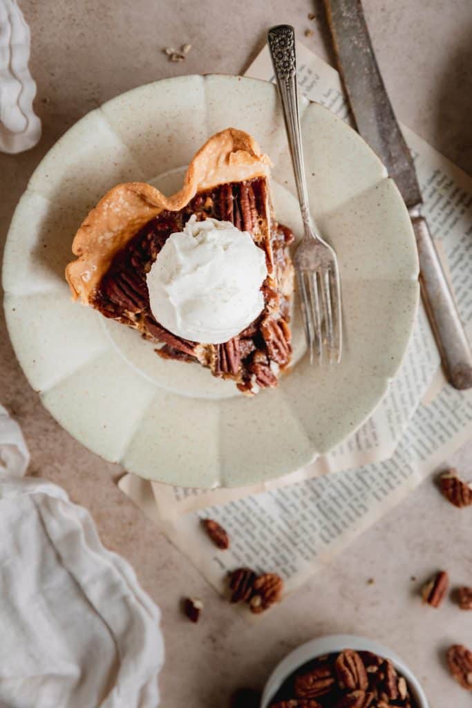 a slice of southern pecan pie with ice cream on top