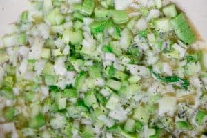 onion and celery being sautéed in butter