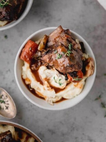 red wine braised short ribs over the top of mashed potaotes