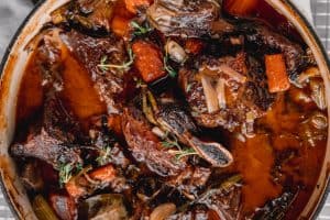 short ribs braising in red wine and beef broth