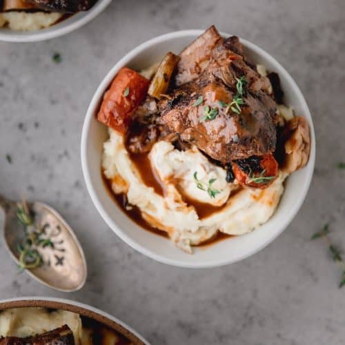 red wine braised short ribs over the top of mashed potaotes