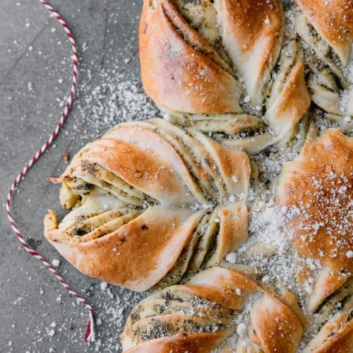 pesto artichoke star bread sprinkled with parmesan cheese