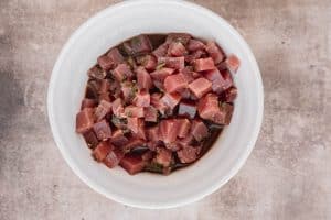 tuna marinating in a bowl