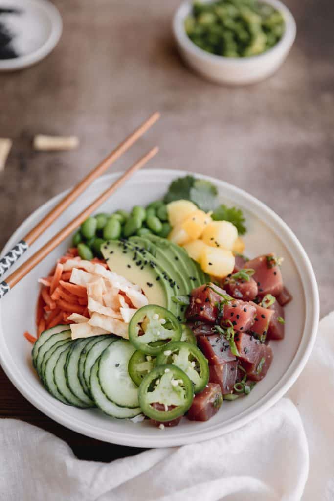 poke bowl with chop sticks on top