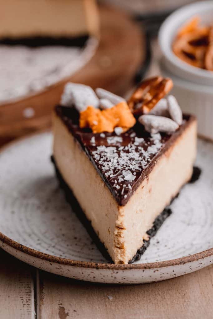 a slice of the best chocolate peanut butter cheesecake