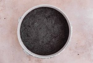 Oreo crust pressed into the spring form pan
