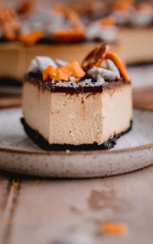 a slice of cheesecake with a bite out of the front