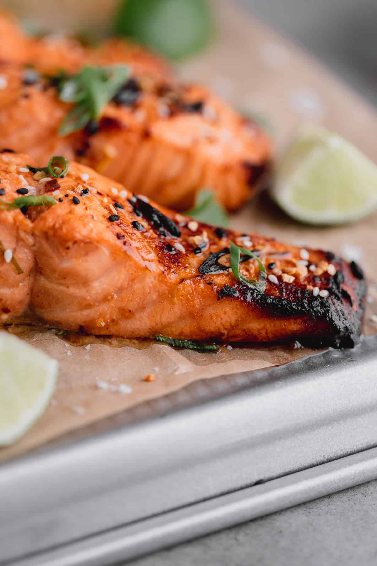 Asian Air Fryer Salmon topped with sesame seeds and cilantro.
