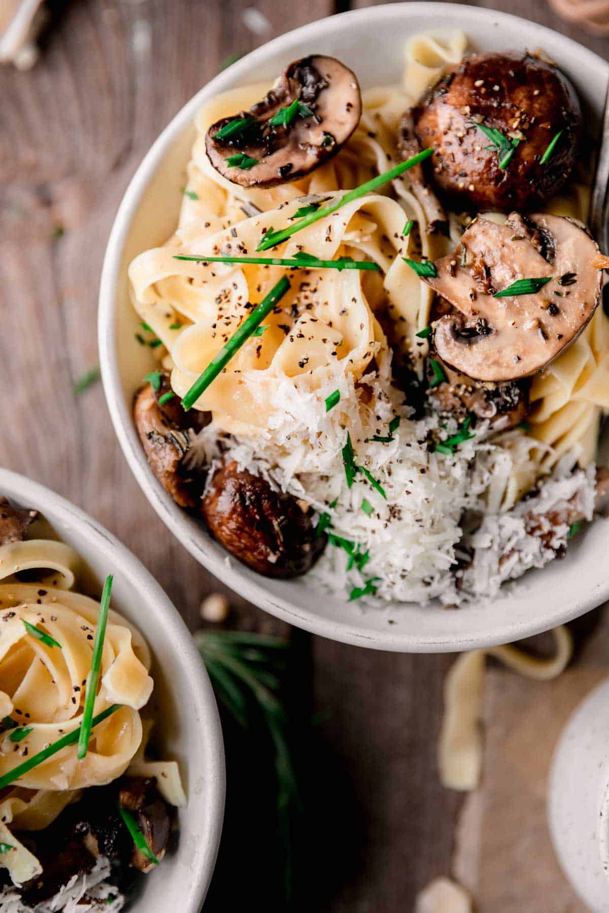 Mushroom Truffle Pasta topped with chives and parmesan cheese. 