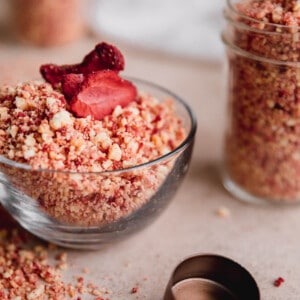 Strawberry Crunch Crumble in a small dish topped with freeze dried strawberry slices.