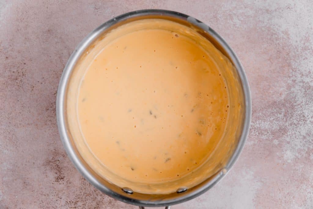 Taco Bell nacho cheese sauce in a medium sauce pot. 