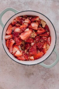 Strawberry jam ingredients in a pot.