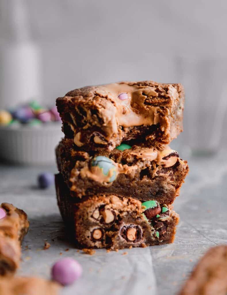 a stack of Easter blondies with a bite taken out of the top one