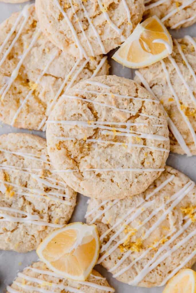 lemon ricotta cookies drizzled with lemon glaze and lemon wedges
