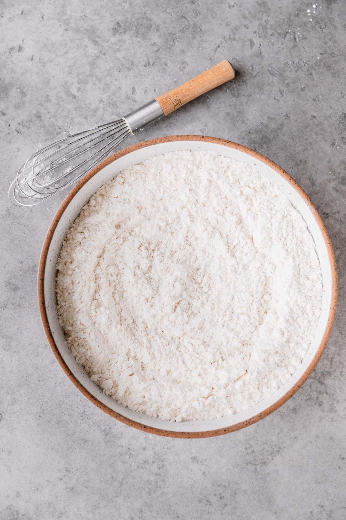Flour salt, cornstarch and baking soda whisked together in a large mixing bowl.