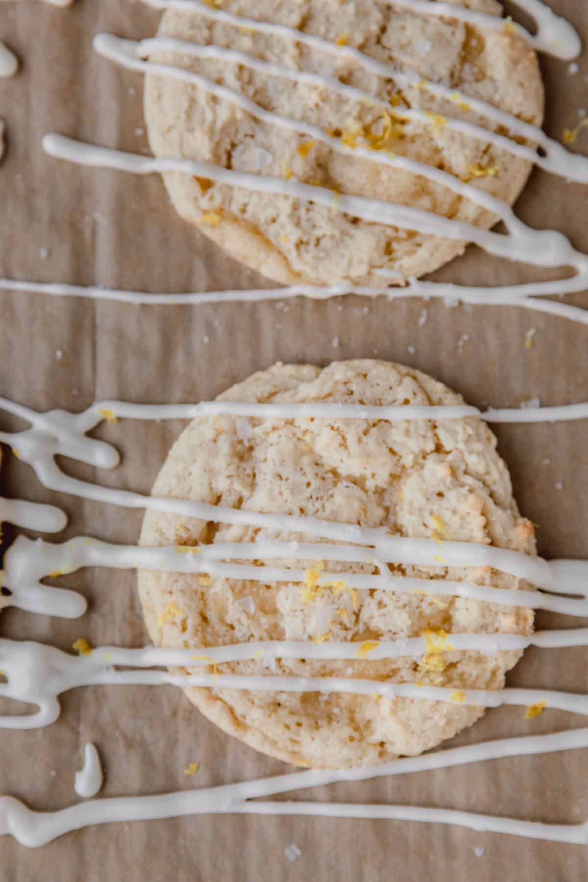 Lemon ricotta cookie recipe just after being drizzled with lemon frosting. 