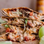 Taco Bell Crunchwrap Supreme with cheese sauce, ground beef, tomato and lettuce.