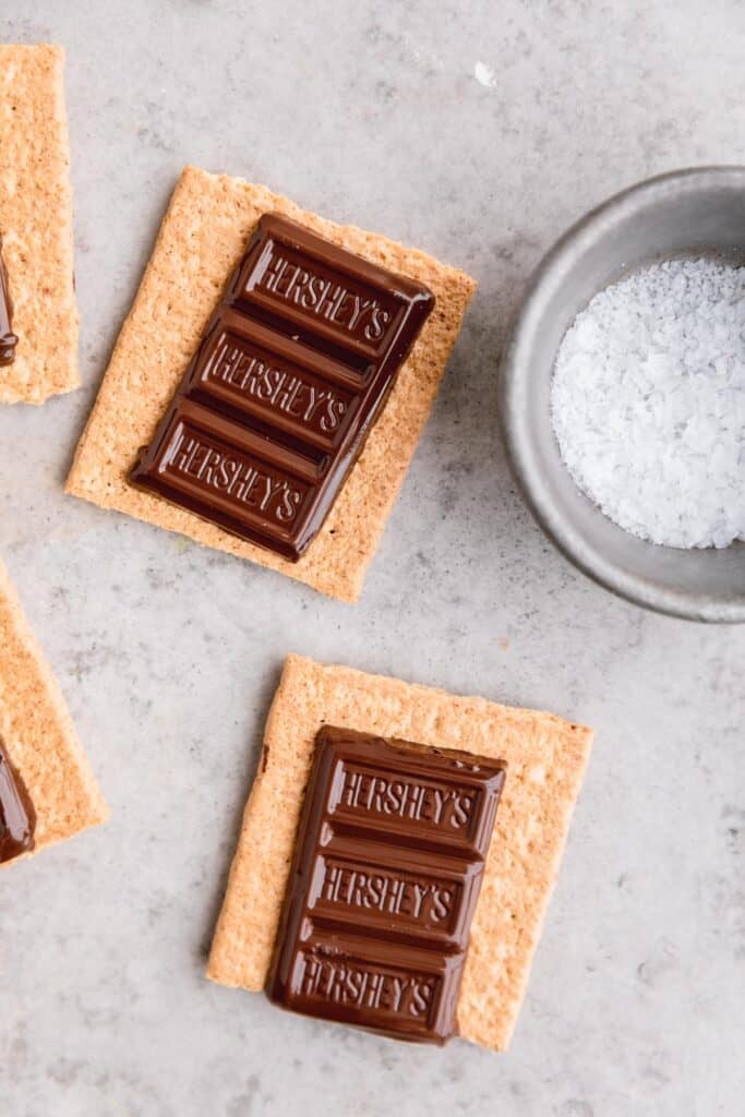 Hershey's chocolate on graham crackers with a dish of sea salt