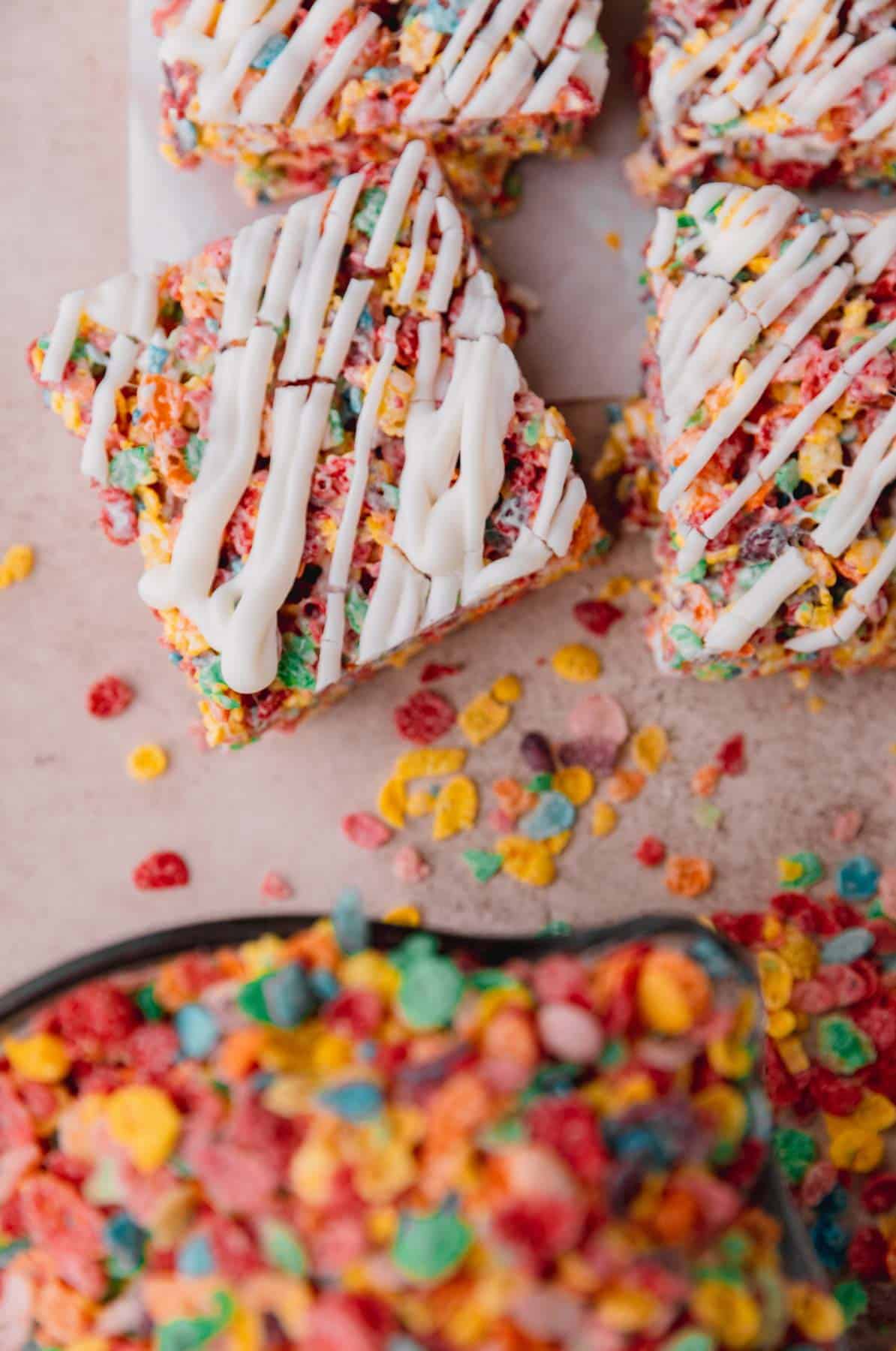 Fruity Pebbles Treats topped with white chocolate. 