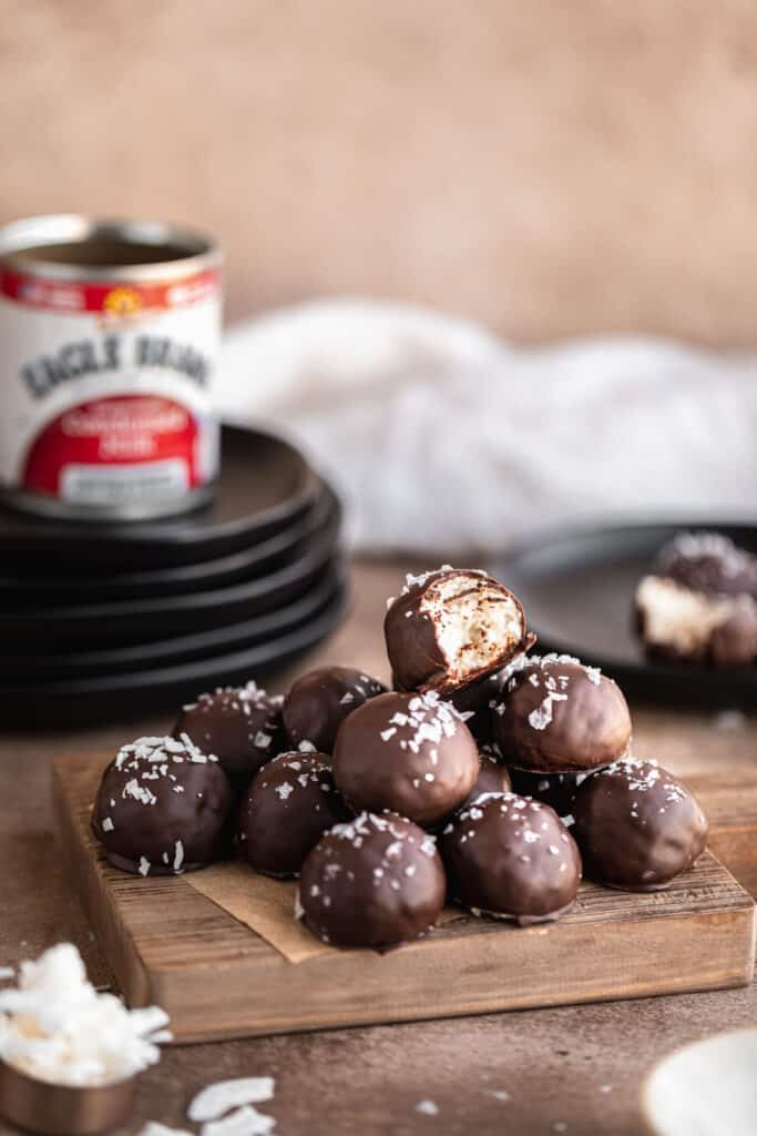 chocolate coconut balls on a wooden tray