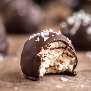 Easy no bake Chocolate Coconut Balls topped with flaky sea salt.