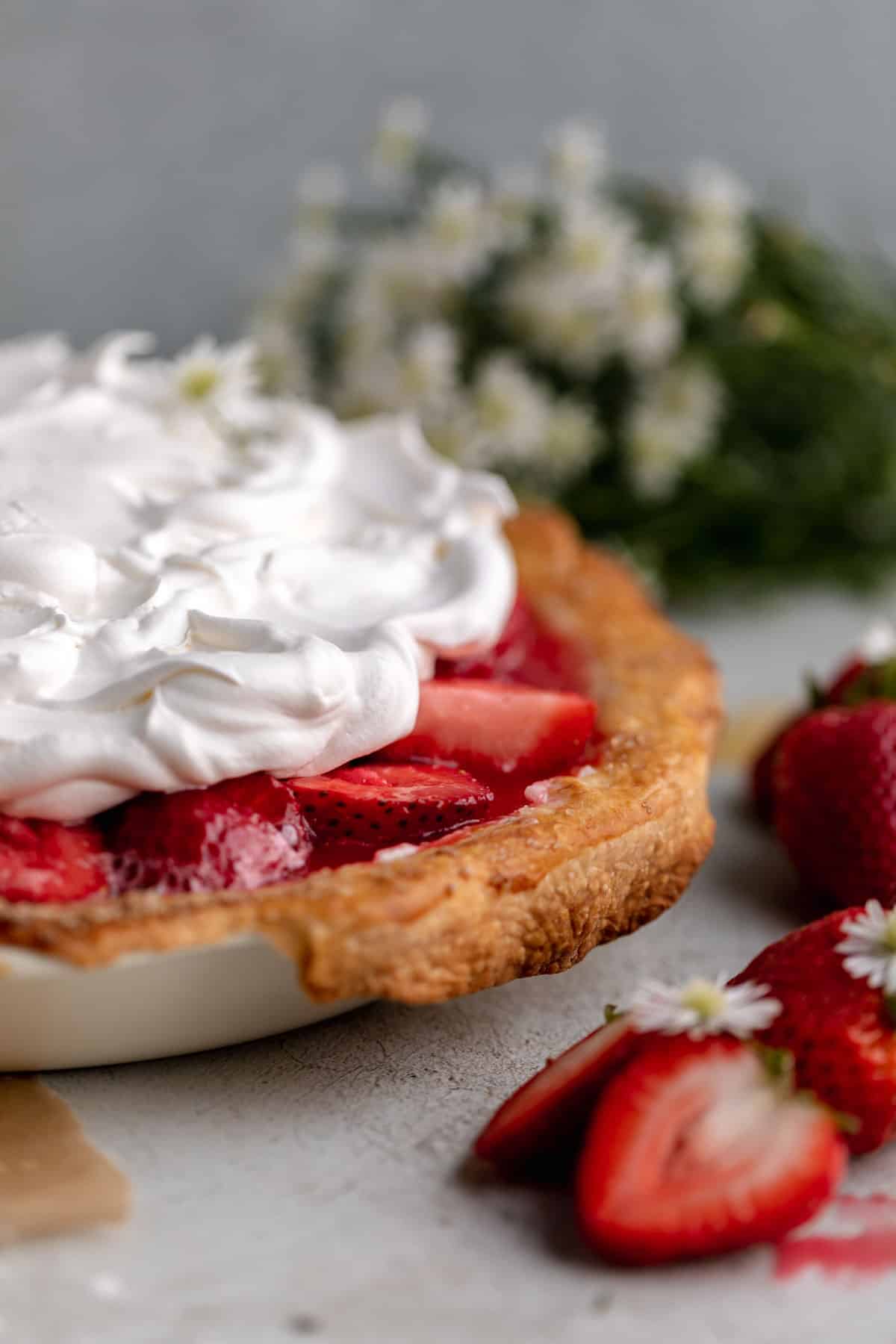 Strawberry Cream Cheese Pie with Jell-O, topped with whipped cream.