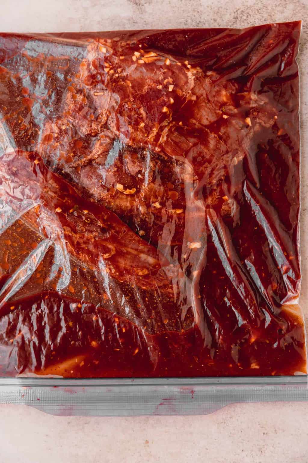 Marinating skirt steak in a bag.