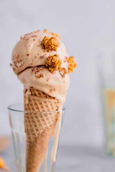 dulce de leche ice cream in a cone with caramel popcorn on top
