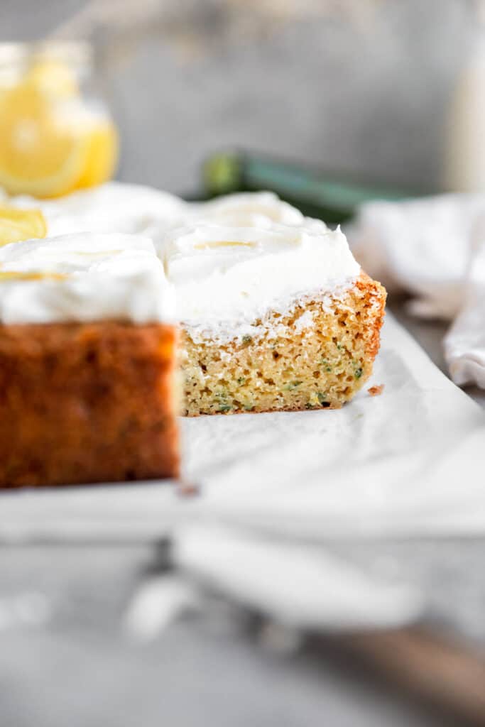 inside view of this ultra-moist lemon zucchini cake with a slice cut out 