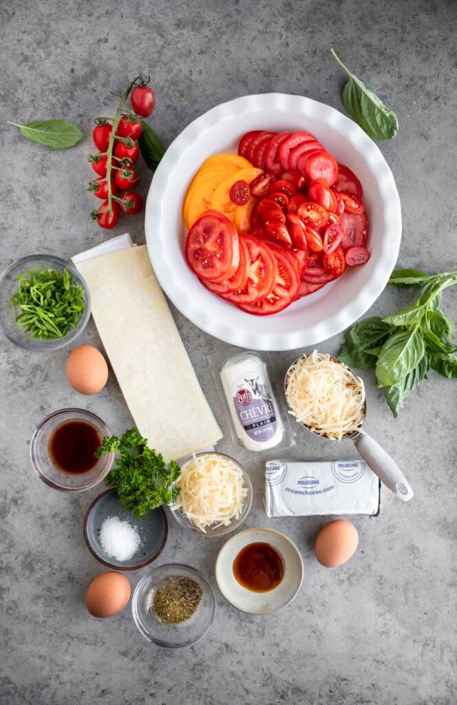 All of the ingredients needed to make this tomato pie recipe laid out.